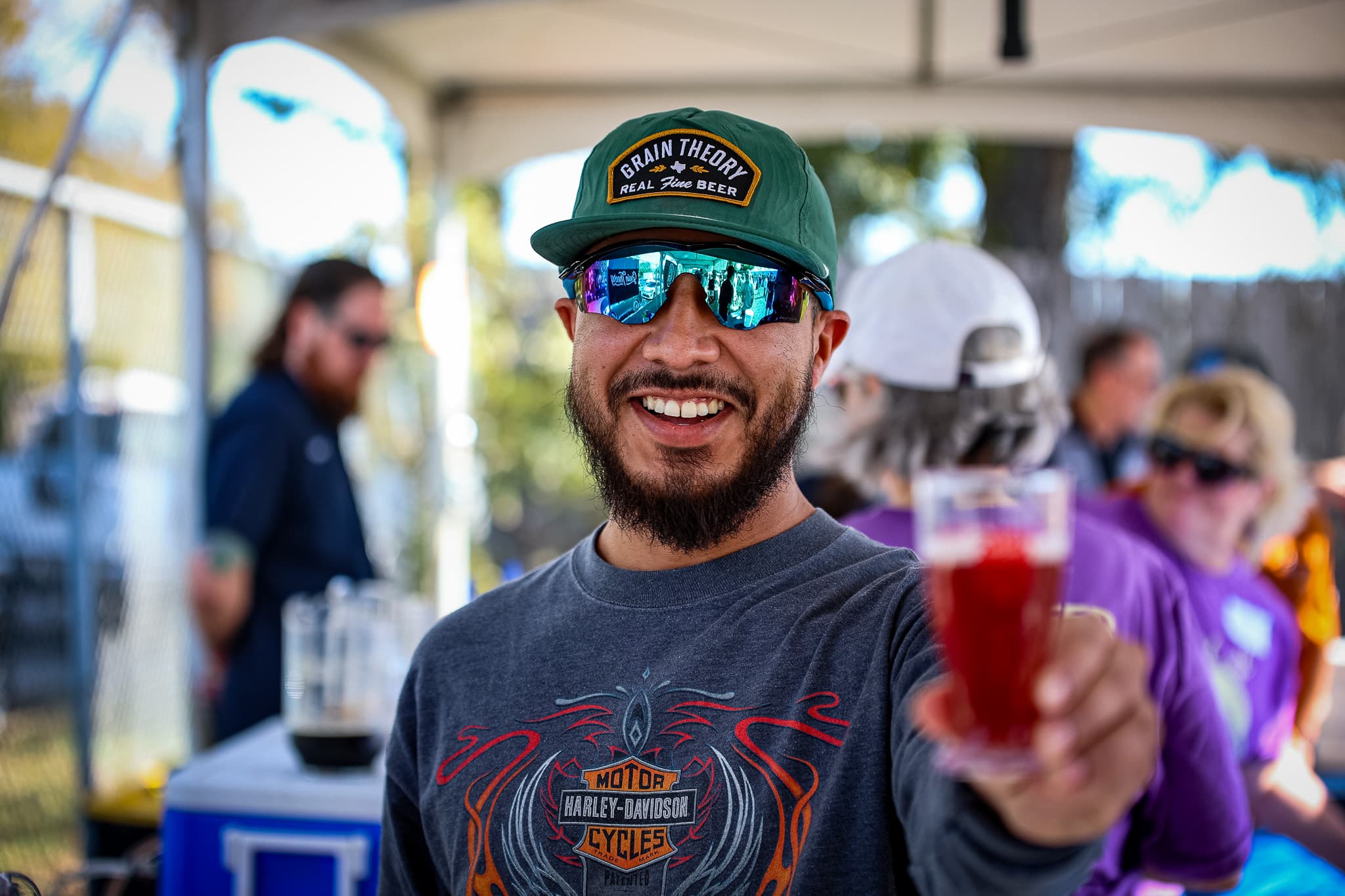 Festival-goers raising glasses at the Texas Craft Brewers Festival